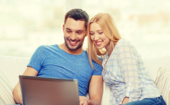 Couple with laptop at home